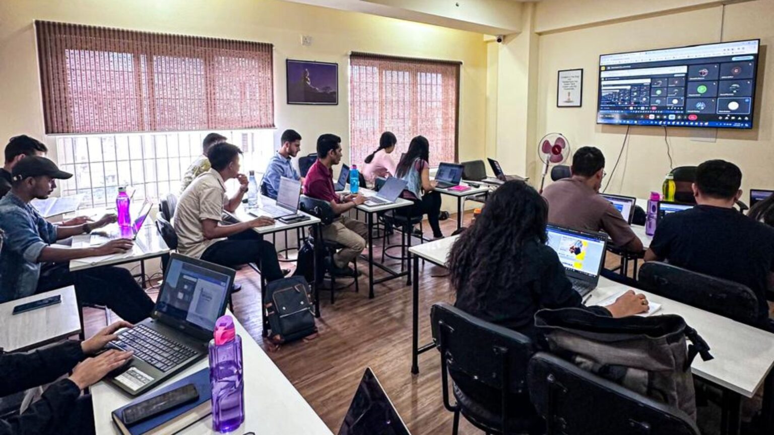 Instructor explaining data science concepts to a class of focused students.